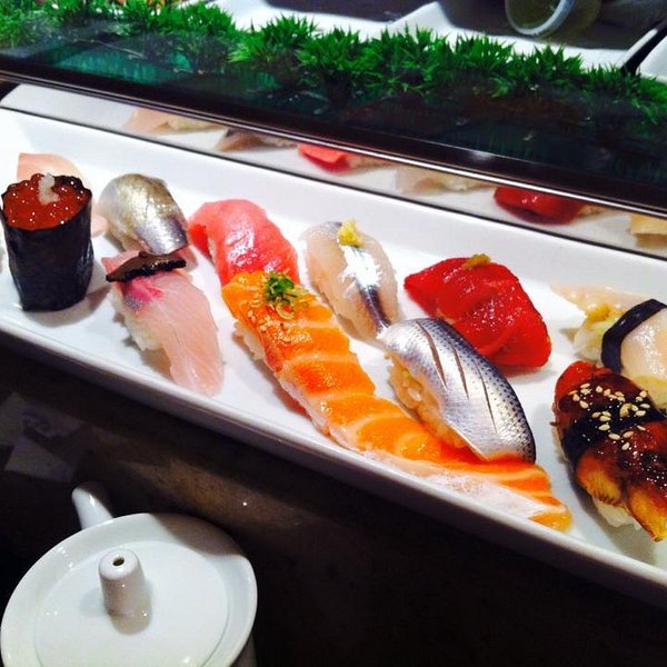 City Market Sushi signature dishes City Market Roll, Dragon Roll, Tuna Tataki, Assorted Nigiri and Sashimi